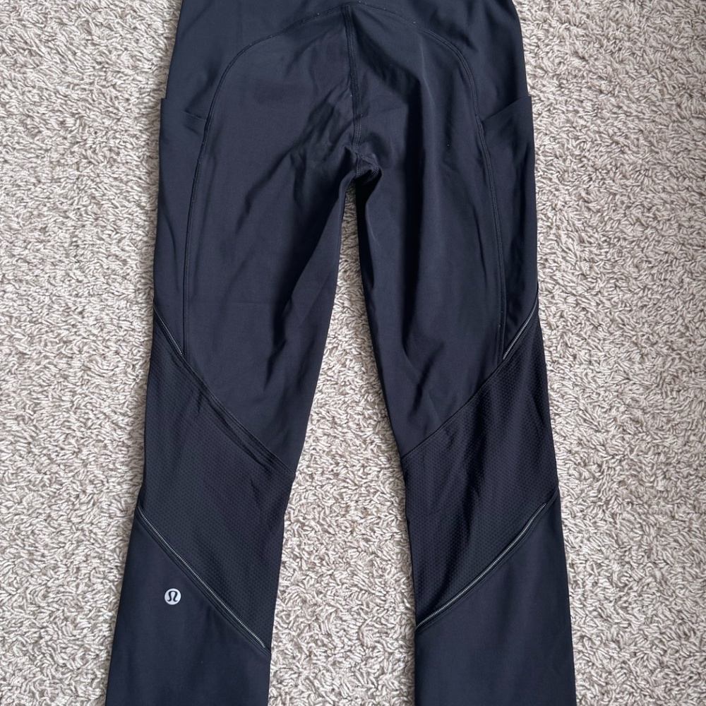 The Lululemon Run Off Route Mid-Rise Crop 21" - Picture 1 of 3